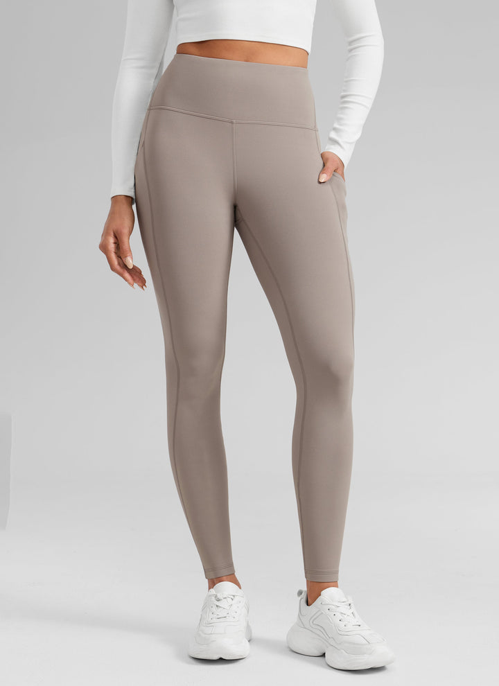 Women's high-waisted ankle-length leggings with side pocket and seam detailing