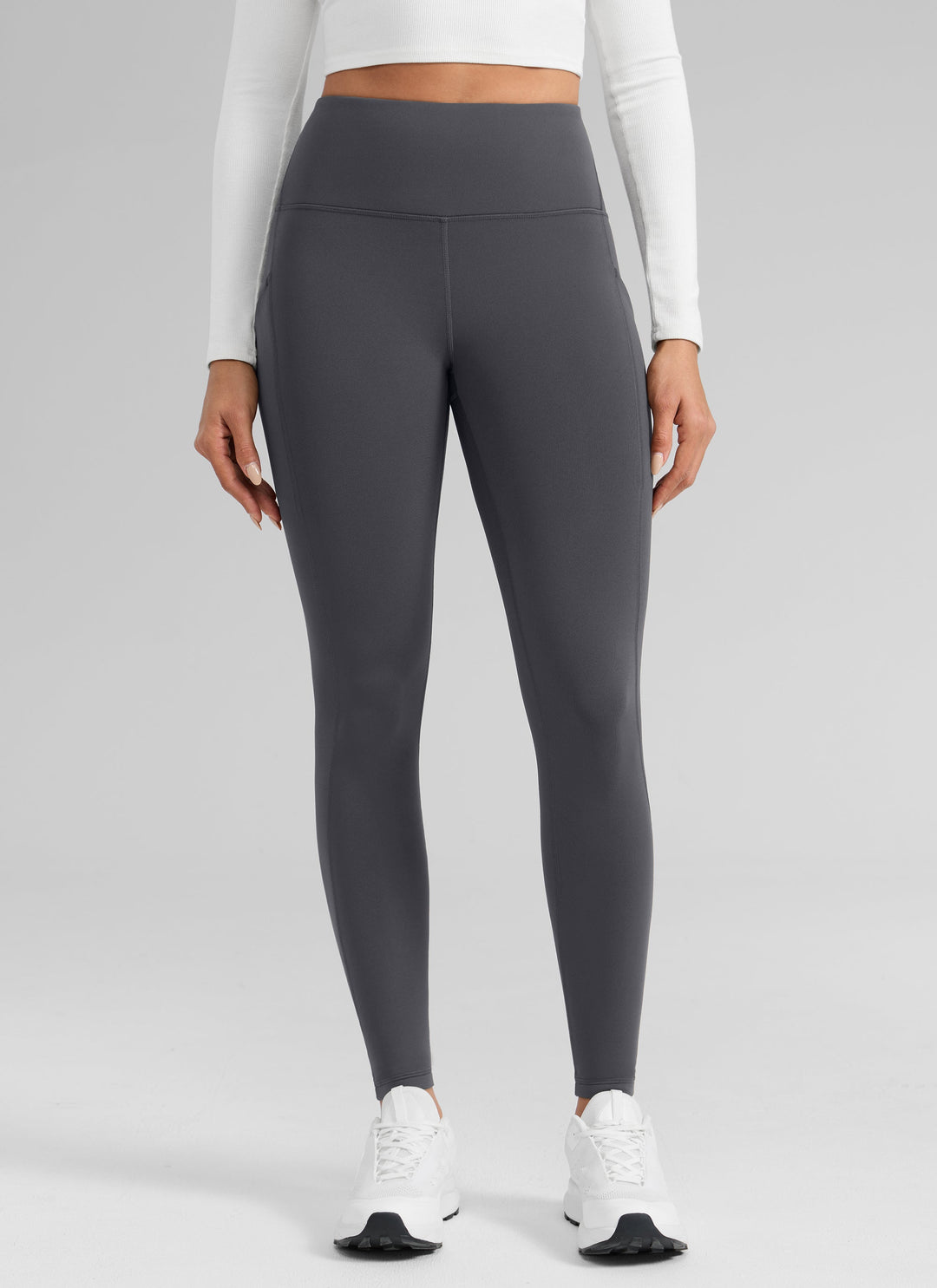 Women's high-waisted ankle-length leggings with side pocket and seam detailing