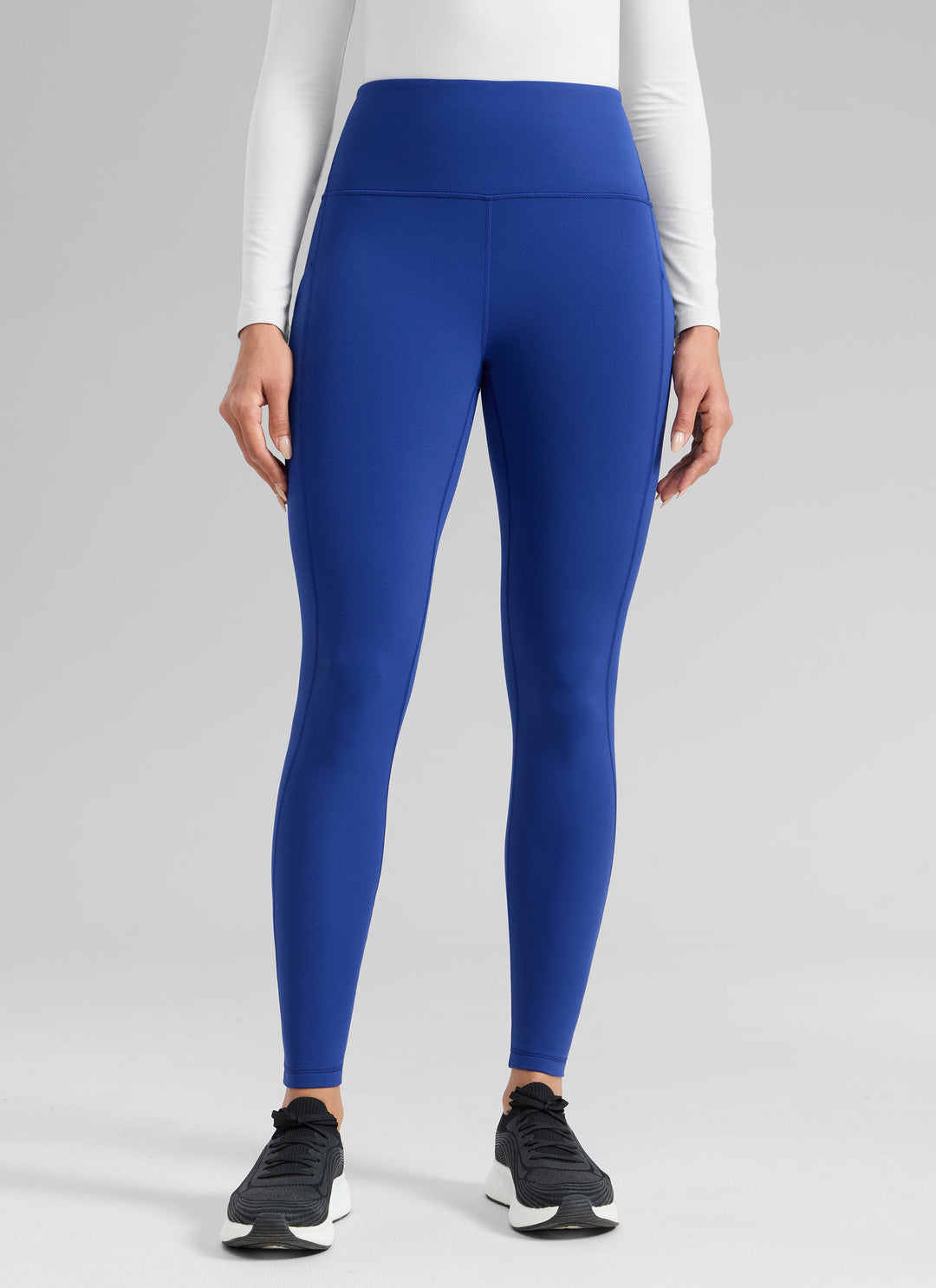 Women's high-waisted ankle-length leggings with side pocket and seam detailing