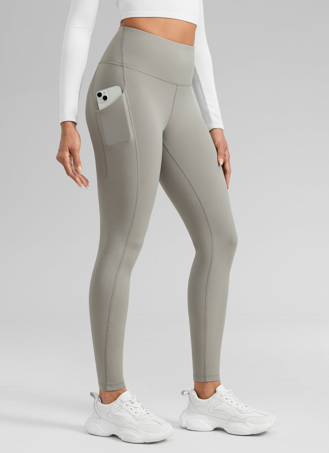 Women's high-waisted ankle-length leggings with side pocket and seam detailing