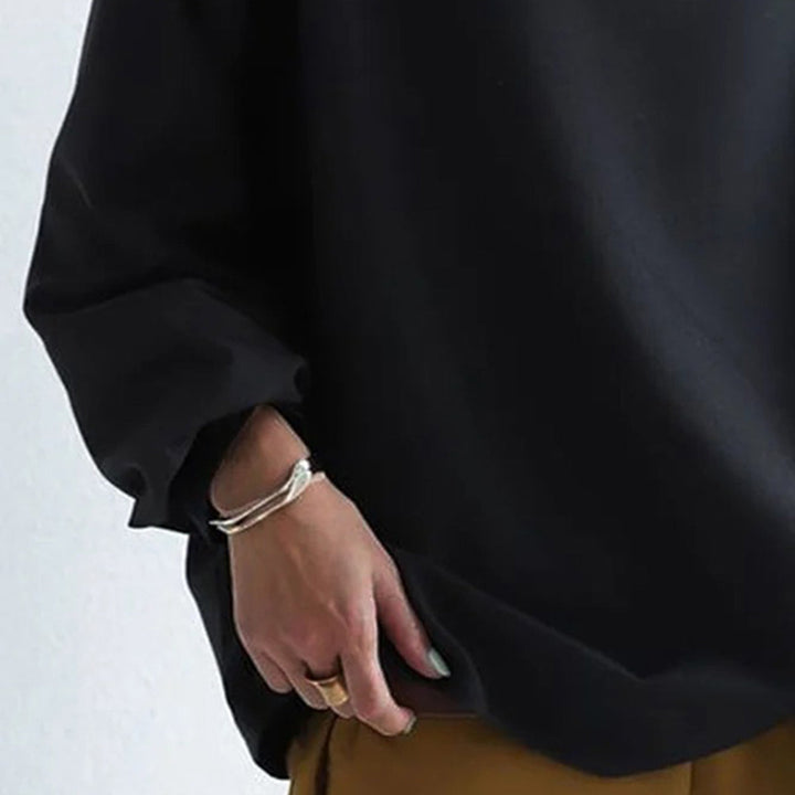 Black high-neck pullover sweater with long sleeves