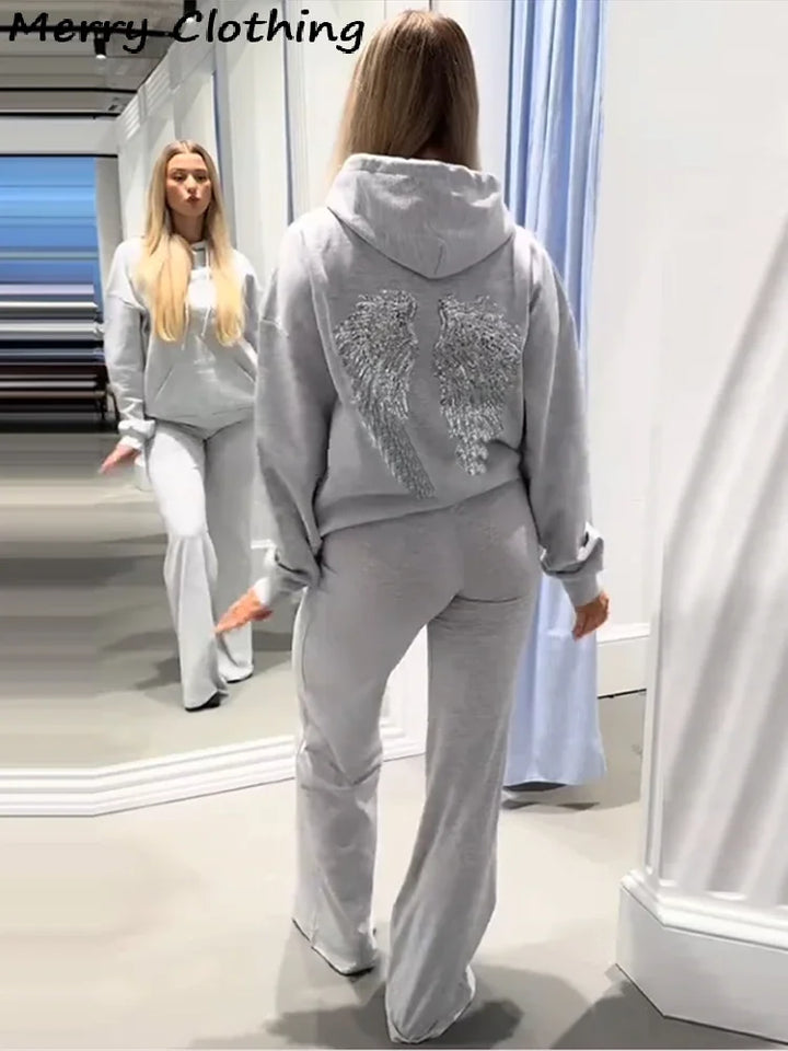 Women's hooded sweatshirt with sequin wing detailing on the back