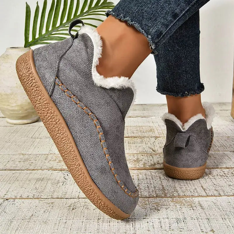 Women's fur-trimmed slip-on ankle boots with round toes and flat textured soles