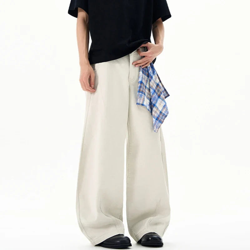Cream wide leg trousers with elastic waistband and checked waist tie