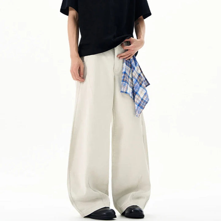 Cream wide leg trousers with elastic waistband and checked waist tie