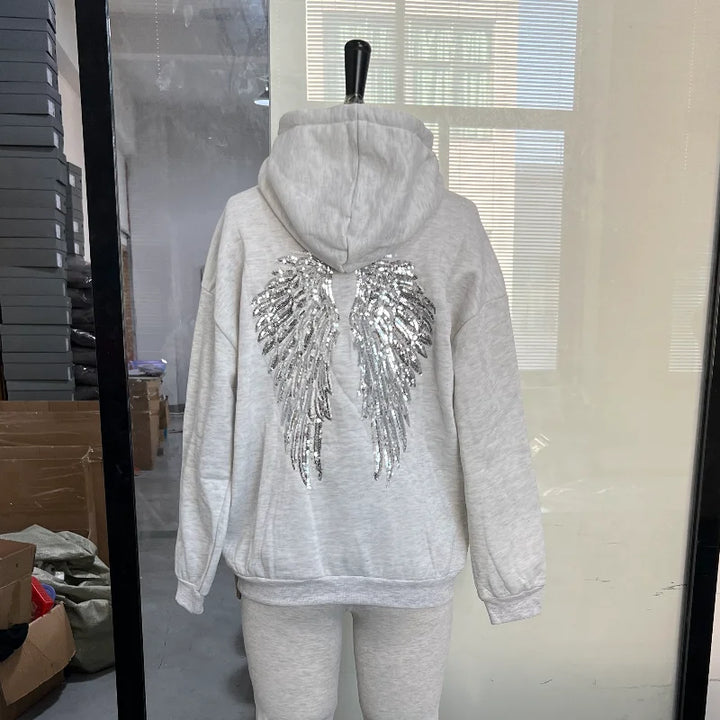 Women's hooded sweatshirt with sequin wing detailing on the back