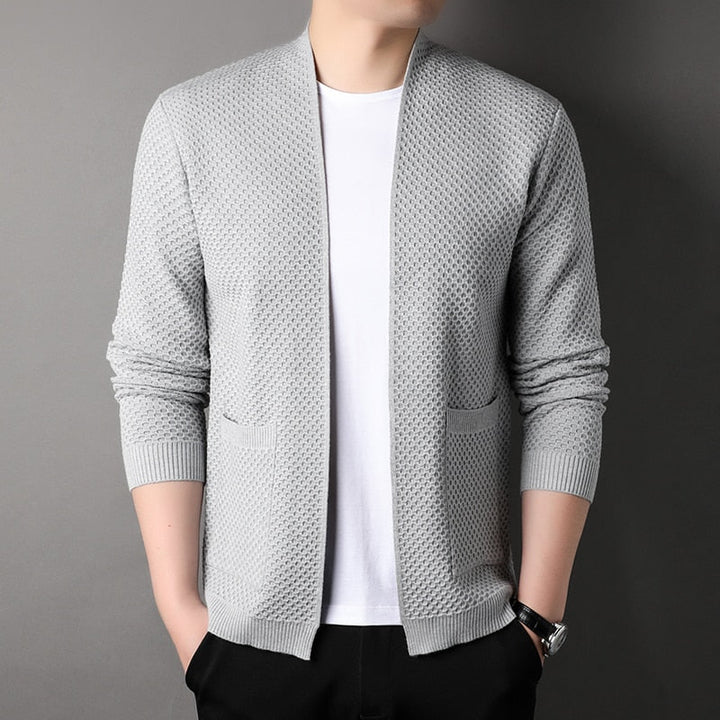 Men's textured open front cardigan with long sleeves and patch pockets