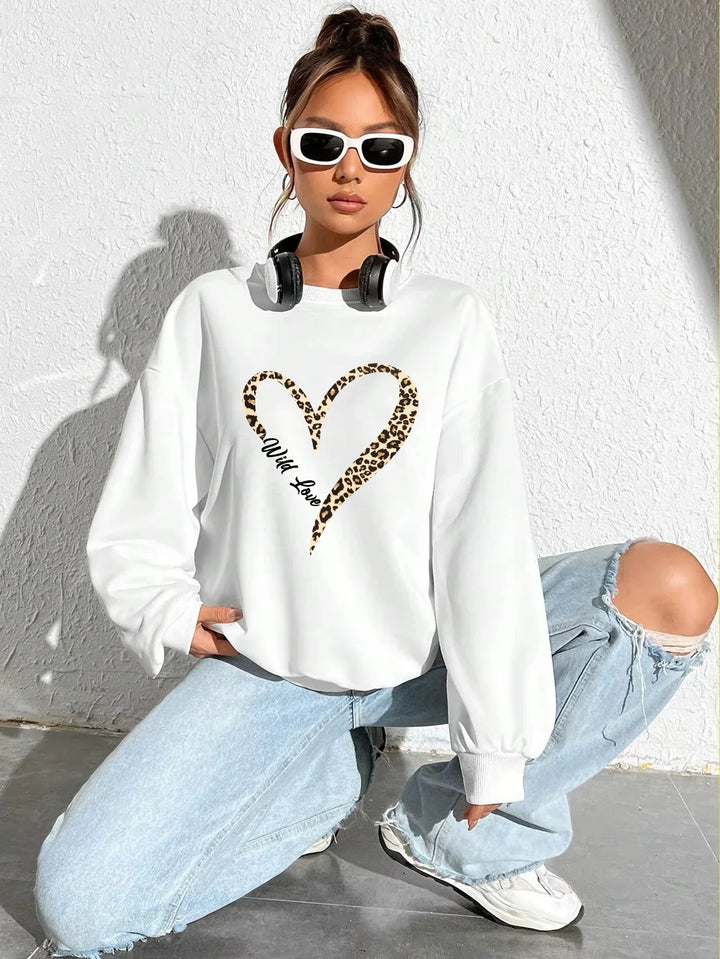 Women's crew neck sweatshirt with leopard-print heart graphic and long sleeves