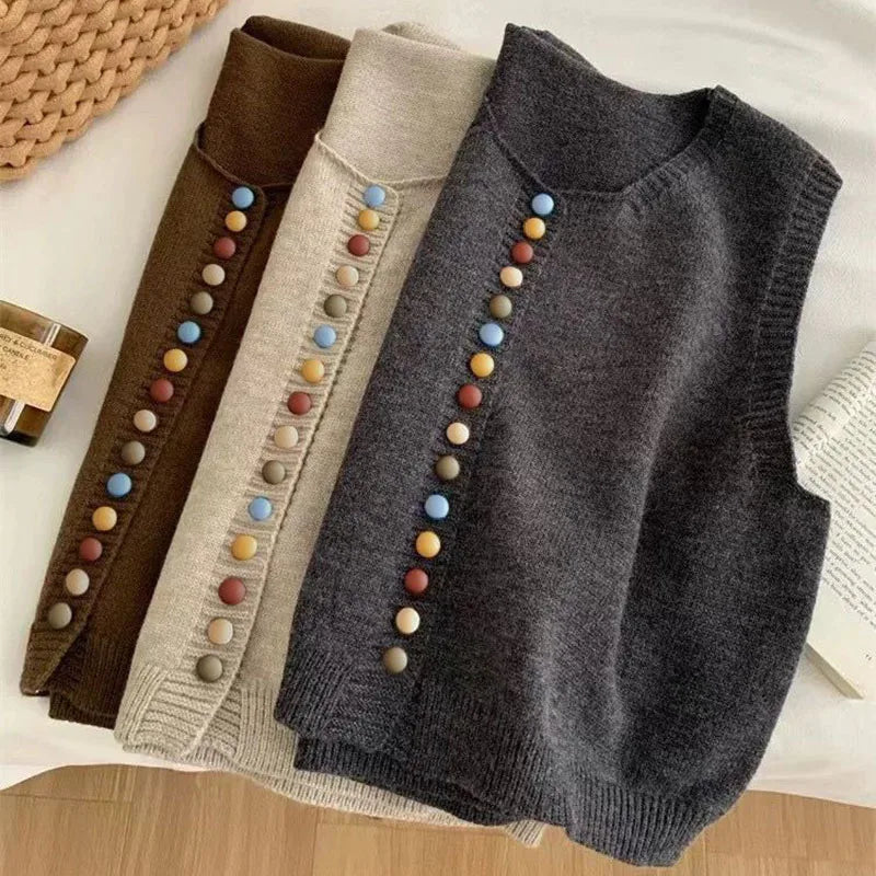 Sleeveless knit vest with round neckline and multicoloured button front