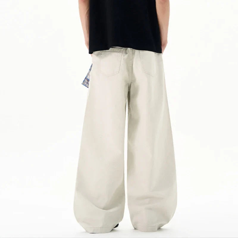 Cream wide leg trousers with elastic waistband and checked waist tie