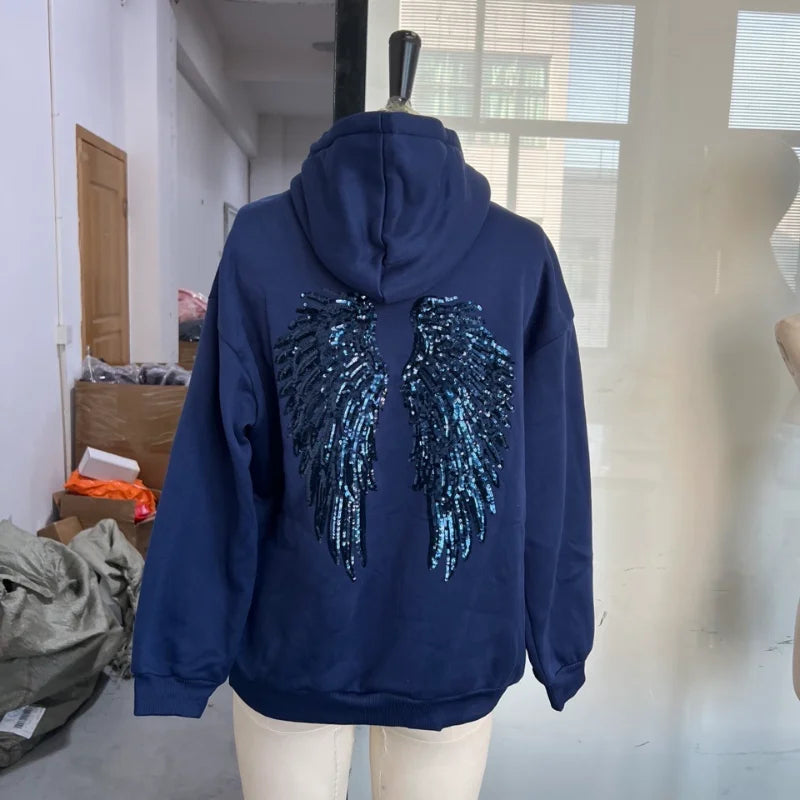 Women's hooded sweatshirt with sequin wing detailing on the back