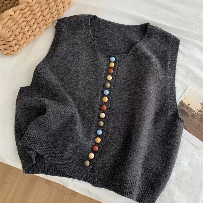 Sleeveless knit vest with round neckline and multicoloured button front
