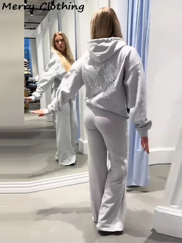 Women's hooded sweatshirt with sequin wing detailing on the back