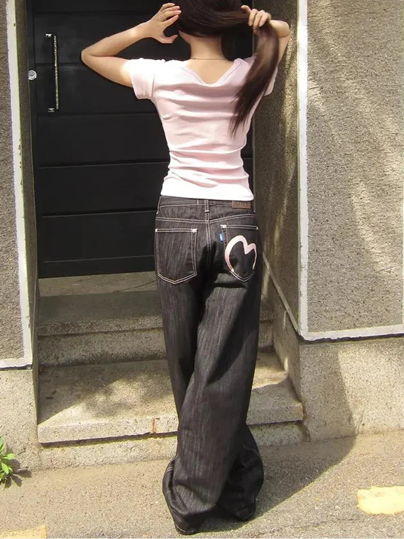 Women's gray wide leg jeans with heart back pocket detail