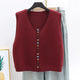 Sleeveless knit vest with round neckline and multicoloured button front