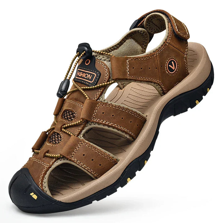 Men's closed-toe hiking sandal with adjustable velcro straps and cushioned midsole, shown in brown and navy colorways