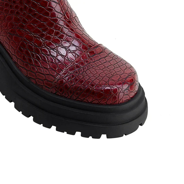 Women's pull-on ankle boots with textured upper and black lug sole