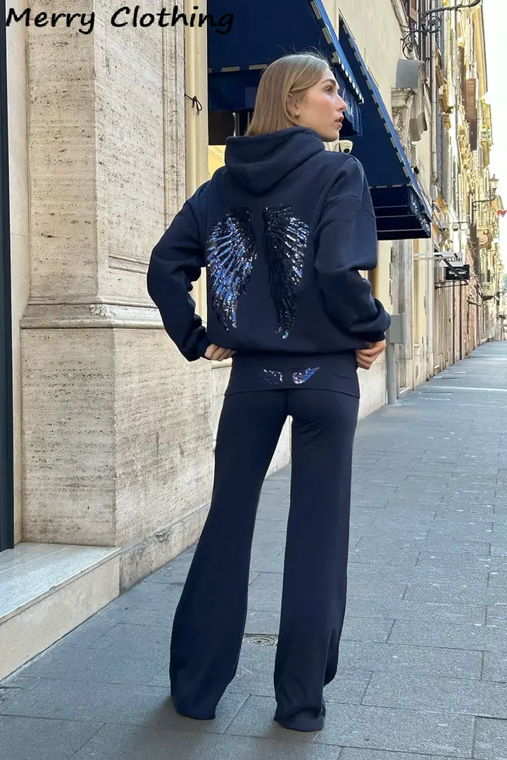 Women's hooded sweatshirt with sequin wing detailing on the back