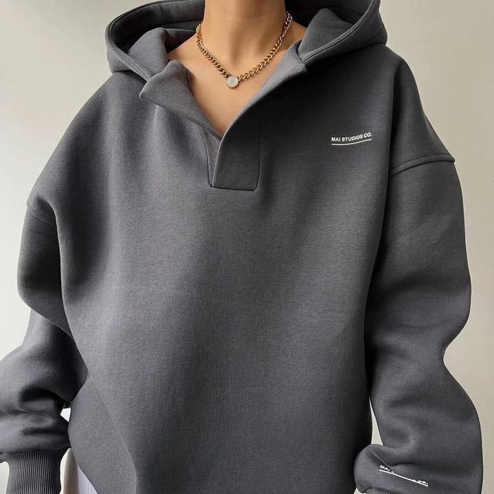 Women's hooded pullover with split V-neck and ribbed cuffs