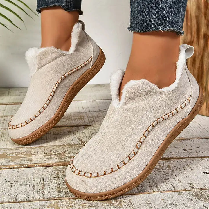 Women's fur-trimmed slip-on ankle boots with round toes and flat textured soles