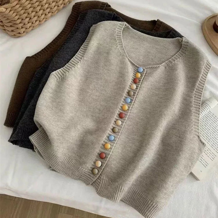Sleeveless knit vest with round neckline and multicoloured button front