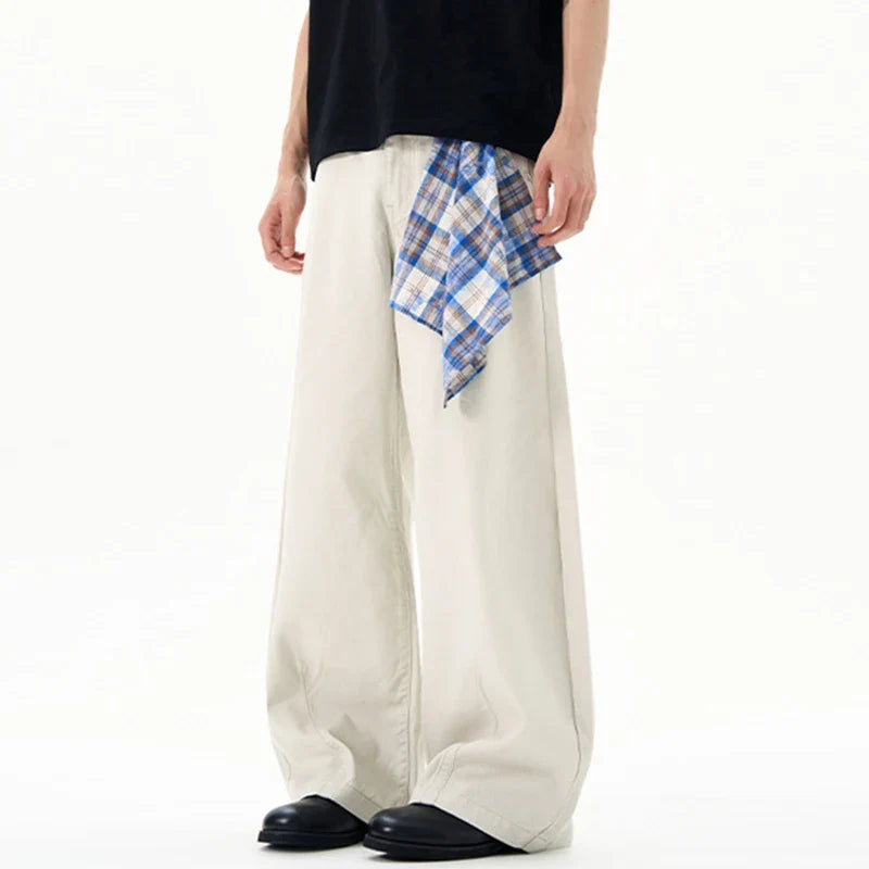 Cream wide leg trousers with elastic waistband and checked waist tie