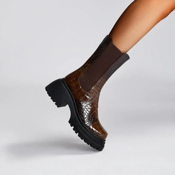 Women's pull-on ankle boots with textured upper and black lug sole
