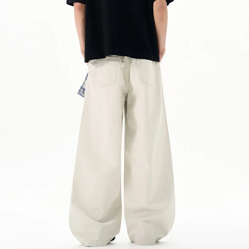 Cream wide leg trousers with elastic waistband and checked waist tie