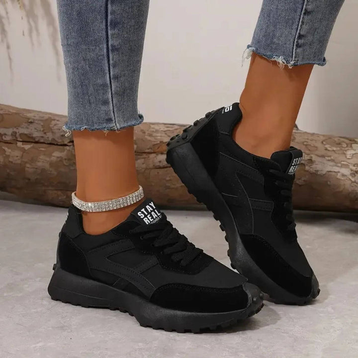 Women's black and beige geometric lace-up sneakers with textured soles