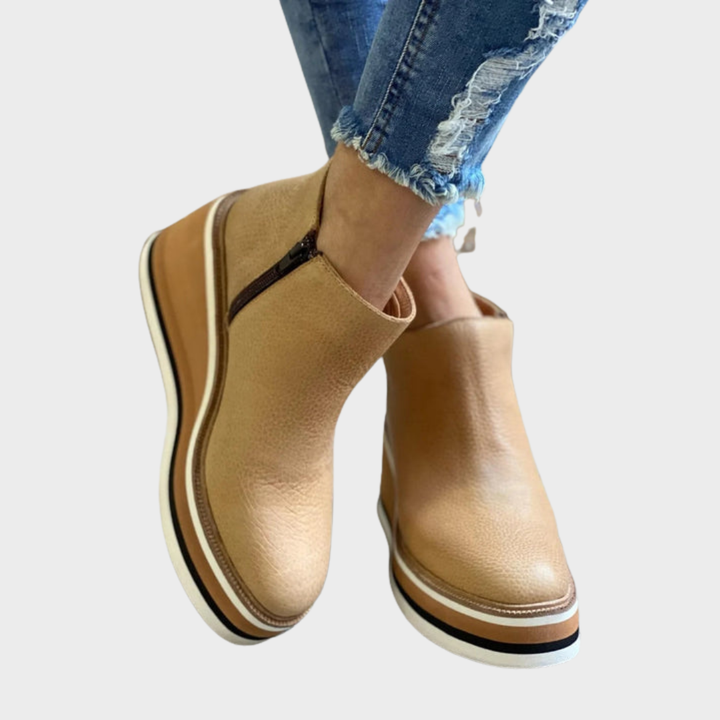 Women's slip-on ankle boots with round toes and layered flat soles