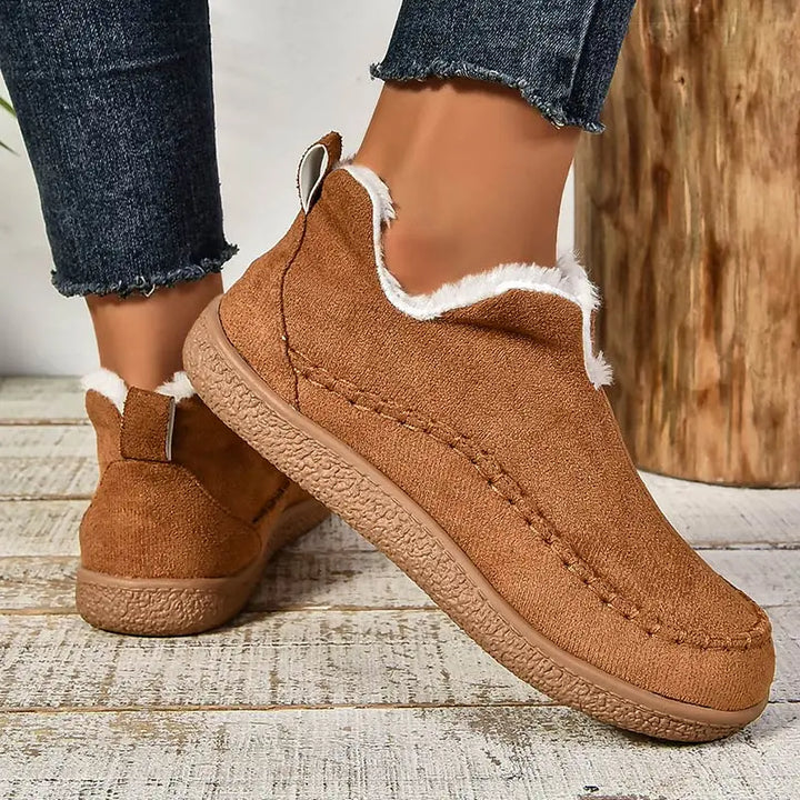 Women's fur-trimmed slip-on ankle boots with round toes and flat textured soles