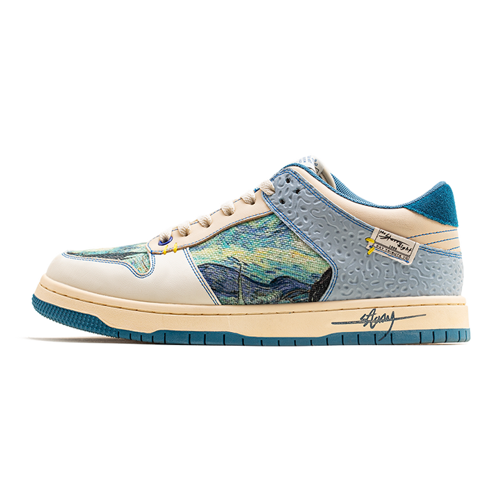 Low-top sneakers with abstract scenic artwork panels and blue soles