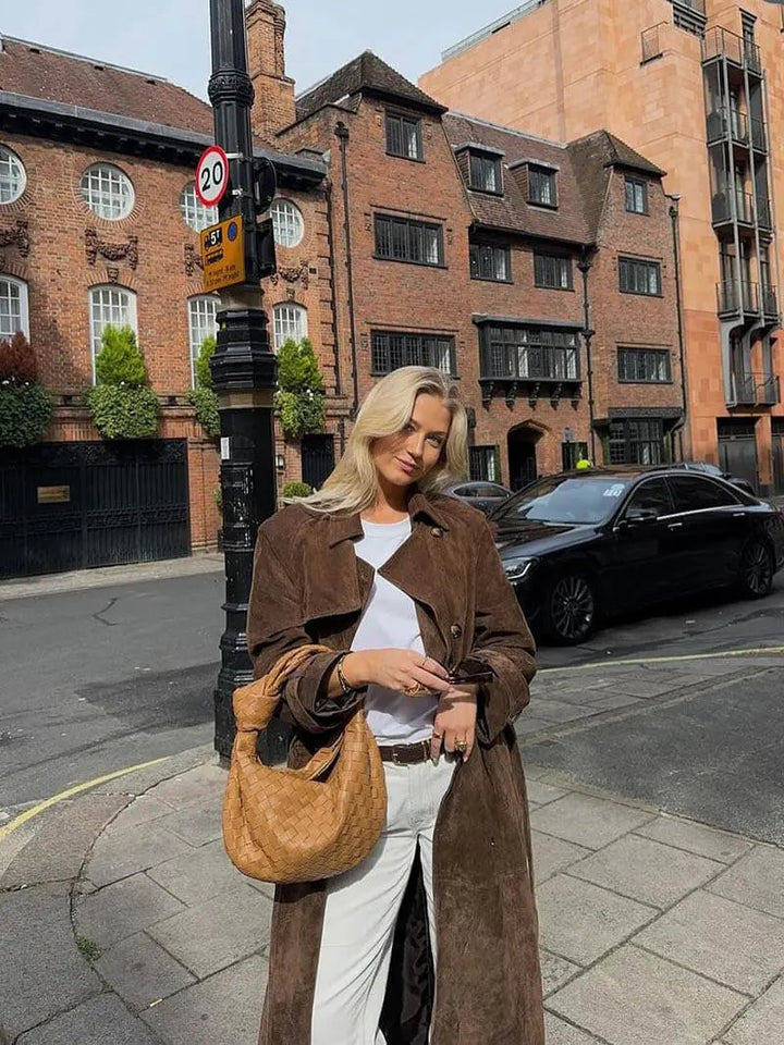 Women's brown full-length trench coat with contrast lapels and waist belt
