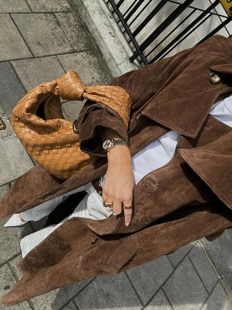 Women's brown full-length trench coat with contrast lapels and waist belt