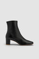 Black women's ankle boots with rounded toe and mid block heel