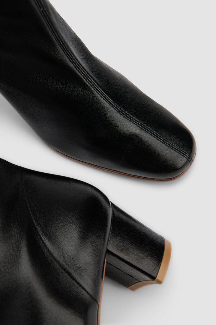 Black women's ankle boots with rounded toe and mid block heel