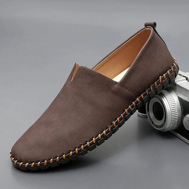 Round toe slip-on loafers with contrast stitched sole trim