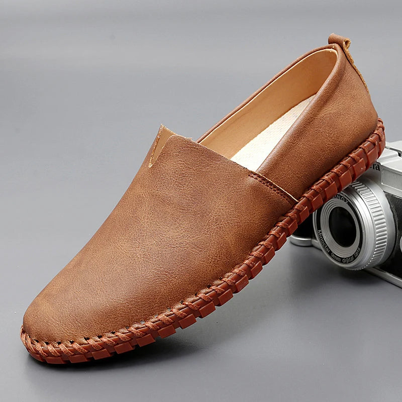 Round toe slip-on loafers with contrast stitched sole trim