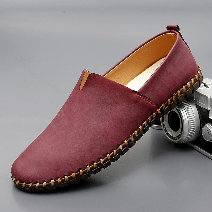 Round toe slip-on loafers with contrast stitched sole trim