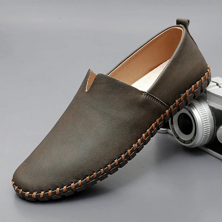 Round toe slip-on loafers with contrast stitched sole trim
