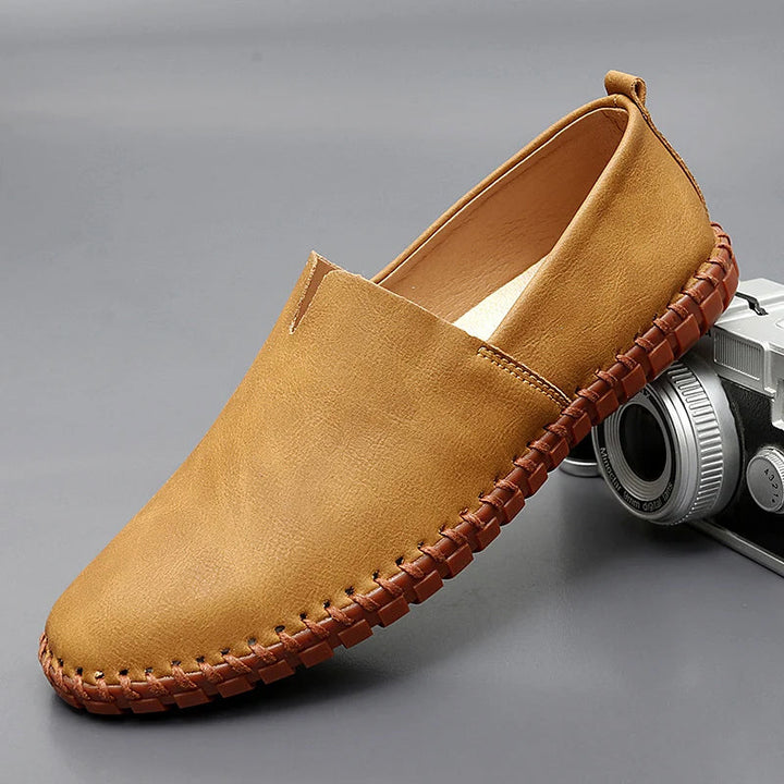 Round toe slip-on loafers with contrast stitched sole trim