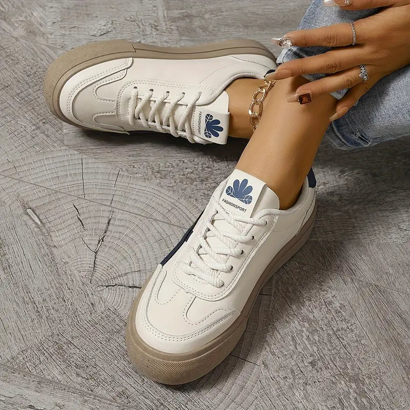 Low-top lace-up sneakers with contrasting side stripes and textured soles