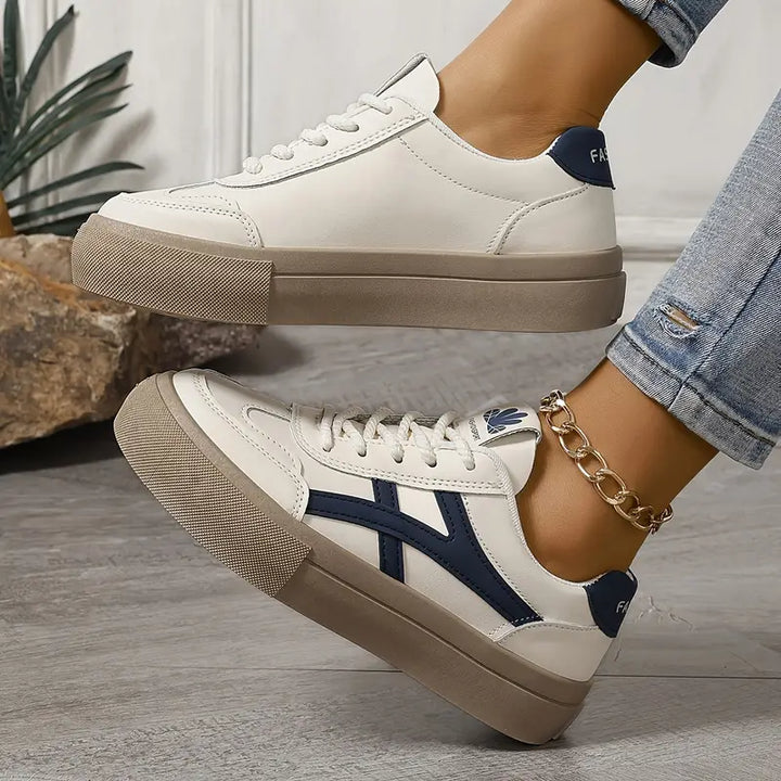 Low-top lace-up sneakers with contrasting side stripes and textured soles