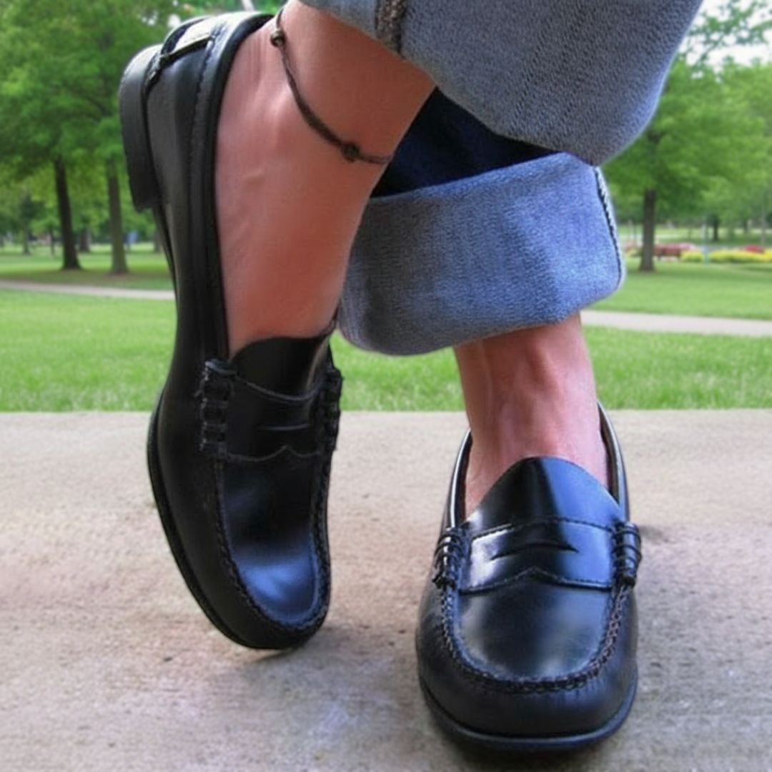 Women's slip-on loafers with moc toes, penny strap detail and low heels