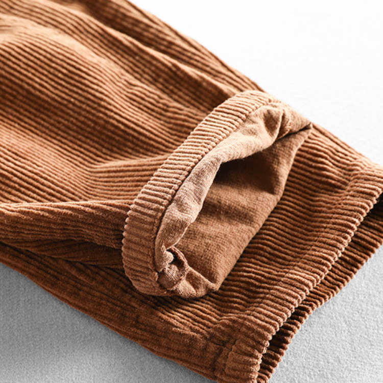 Men's ribbed corduroy pants with tapered legs and cuffed hems
