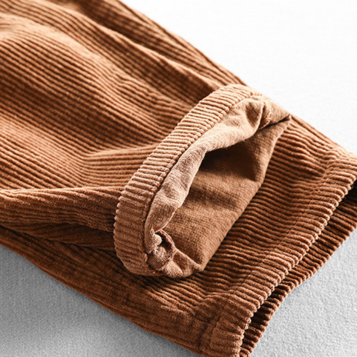 Men's ribbed corduroy pants with tapered legs and cuffed hems