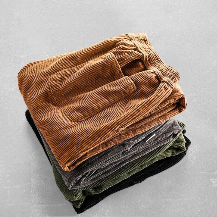 Men's ribbed corduroy pants with tapered legs and cuffed hems