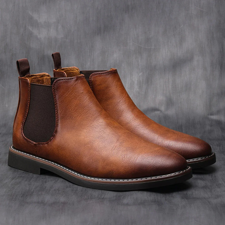 Chelsea ankle boots with elastic side panels, rear pull tabs and low heels