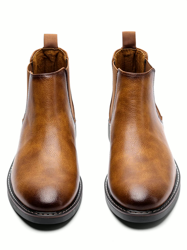Chelsea ankle boots with elastic side panels, rear pull tabs and low heels
