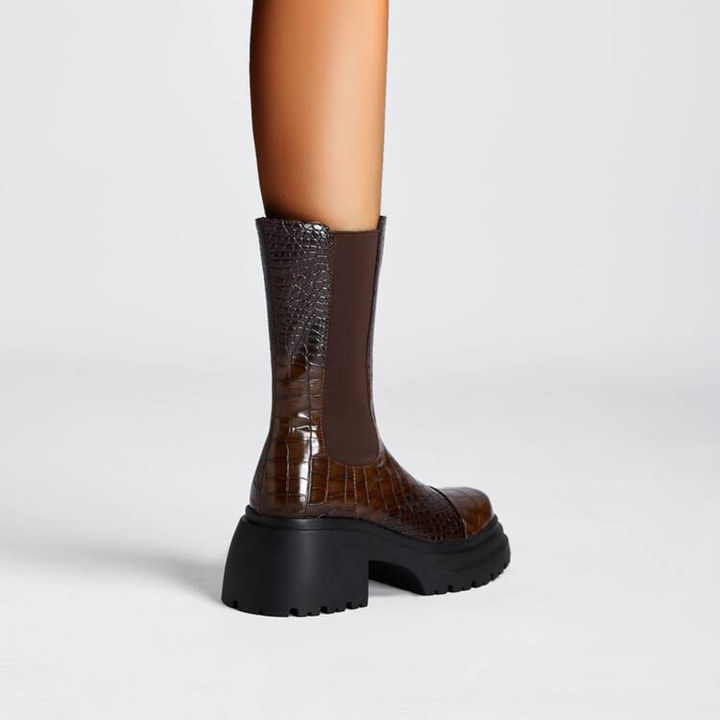 Women's pull-on ankle boots with textured upper and black lug sole